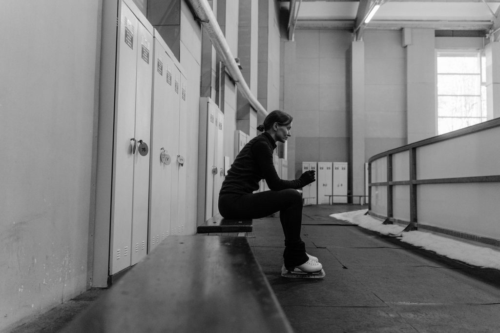 a woman sat down looking lonely